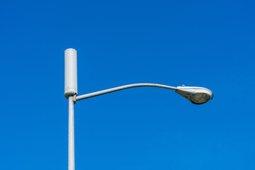 A typical small cell antenna for 5G wireless network installed on a street light pole.