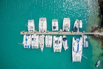 Aerial view from directly above of expensive yachts and jetty Praslin, Seychelles.