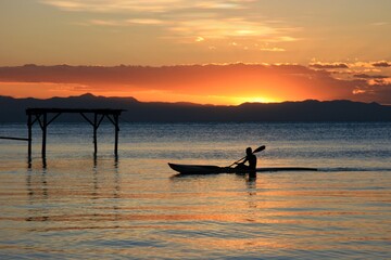Beautiful sunset with traditional kayak on Lake Malawi, Malawi.