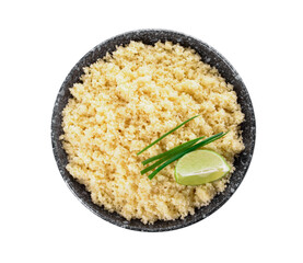 Bowl with tasty couscous, green onion and lime on white background
