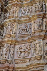Fototapeta na wymiar Detail of the Kandariya Mahadev Temple in Khajuraho, Madhya Pradesh, India. Forms part of the Khajuraho Group of Monuments, a UNESCO World Heritage Site.