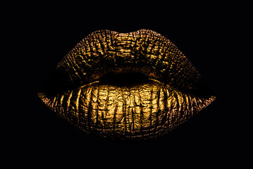 Abstract gold lips. Golden lips closeup. Gold metal art lip. Beautiful makeup. Golden lip gloss on beauty female mouth, closeup. Mouth Icon.