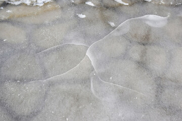 Photo of an ice crust on a concrete pavement