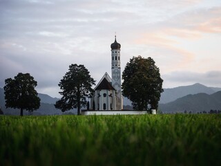 Old historic baroque alpine mountain chapel church St. Coloman at Neuschwanstein Schwangau Allgaeu Bavaria Germany alps