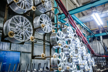 Fototapeta na wymiar Industrial zone. Production workshop with special equipment. Production of the alloy wheels