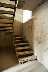 Staircase and plastered walls in the process of renovation.