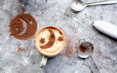 Homemade coffee with moon art and mess left around