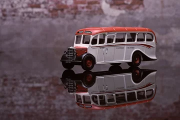 Foto op Plexiglas Side View Of Old Bus With Brick Wall Background © JMorenas