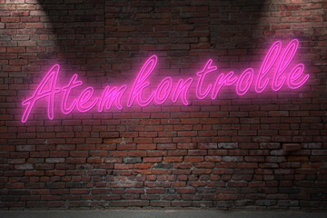 Neon breath control (in german Atemkontrolle) lettering on Brick Wall at night