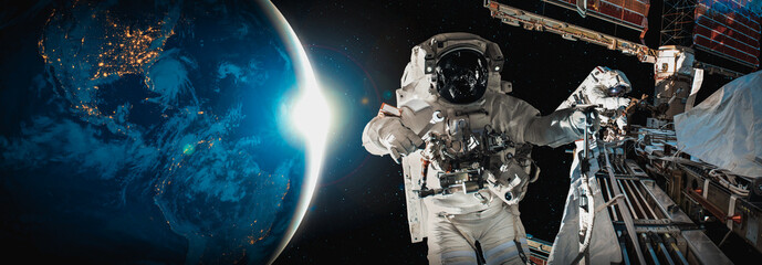 Astronaut spaceman do spacewalk while working for space station in outer space . Astronaut wear full spacesuit for space operation . Elements of this image furnished by NASA space astronaut photos. © InfiniteFlow