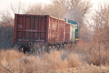Old locomotive with wagons. Railway.