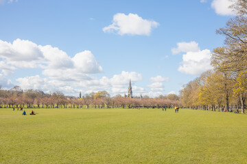 Fototapeta na wymiar Bright, sunny day at the Meadows public city park in Edinburgh, Scotland.