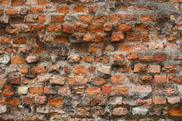Red old crumbling brick wall textured backdrop