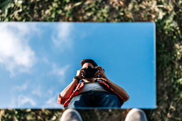 Young photographer taking a selfie