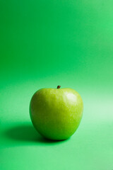 granny smith's green apple on green background