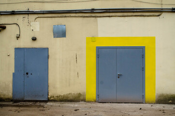 2 iron doors, one outlined in yellow