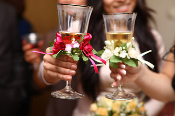 the bride holds a glass of champagne in her hand