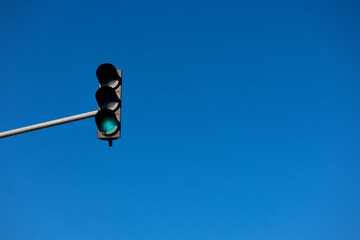 traffic light against the blue sky