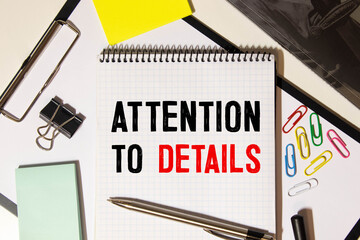 Business concept. Notebook with text ATTENTION TO DETAILS.
