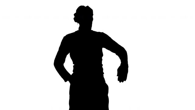 Silhouette Man dressed like mime looking far away.