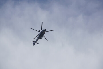 Fototapeta na wymiar helicopter of the german federal police flies in the blue sky
