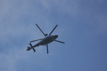 Fototapeta na wymiar helicopter of the german federal police flies in the blue sky