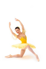 Fototapeta premium Young modern ballet dancer in yellow dress isolated on white background