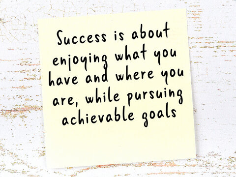 Wise quote on sticky note on wooden wall