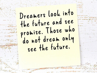 Yellow sticky note with handwritten motivational quote