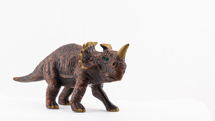 isolated plastic toy dinosaur on white background