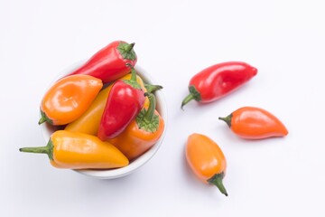 Overview of peppers on white.