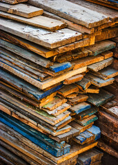 Old planks in stack on backyard
