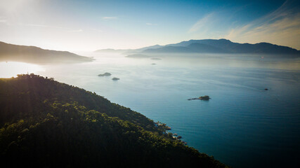 In the early morning hours, the sunlight illuminates the sea of the Angra dos Reis bay and its beaches, Rio de Janeiro - Brazil