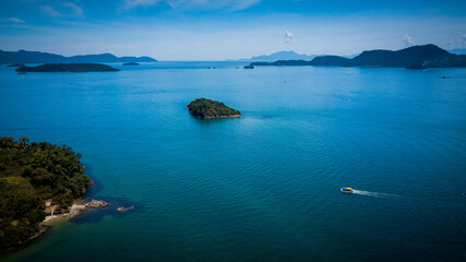 In the early morning hours, the sunlight illuminates the sea of the Angra dos Reis bay and its beaches, Rio de Janeiro - Brazil