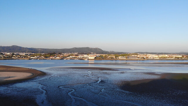 Aerial view of the Northern Litoral Natural Park in Ofir, Esposende, Portugal. The Cavado River estuary at sunset.