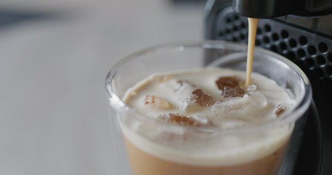 Espresso machine making fresh ice coffee