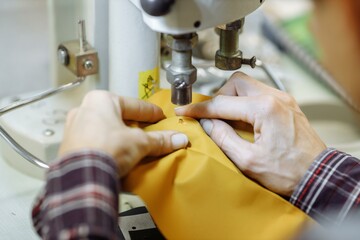 sewing machine scribbling fabric. tailoring at the factory