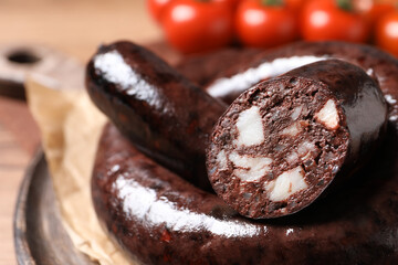 Tasty blood sausages served on board, closeup