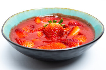 strawberry smoothie in white background. spring or summer healthy food concept. real food