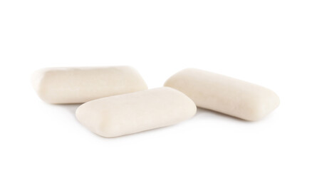 Three sweet chewing gum pieces on white background