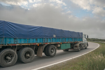 large truck with blue tarpaulin