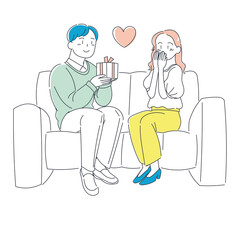 彼女にプレゼントを渡す男性