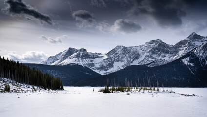 A frozen mountain lake in the Canadian Rocky Mountains in Kananaskis Alberta