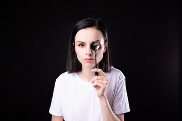 Fototapeta premium woman in white t-shirt holding a tablespoon
