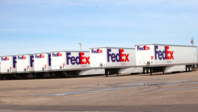 FedEx semi truck trailers lined up at their place of business at the Minneapolis St Paul International Airport. Minneapolis Minnesota MN USA