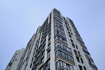 Fototapeta na wymiar High-rise residential building against the sky. Elite area