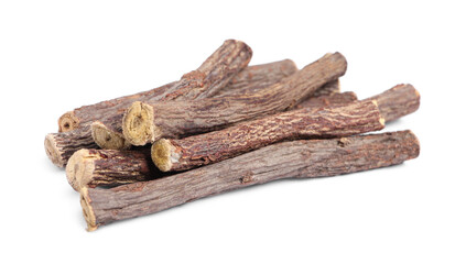 Dried sticks of liquorice root on white background