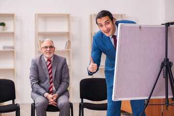 Two male employees in business meeting concept