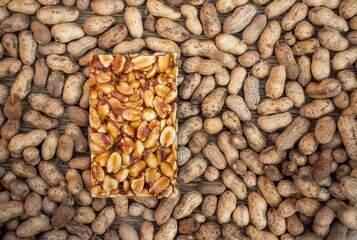 Peanut Chikki Indian Brittle Sweet Isolated on Peanut Pods with Copy Space, Peanut Jaggery Sweet Snack