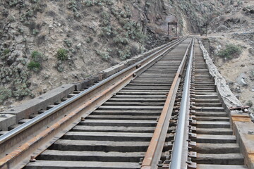 Fototapeta na wymiar train path over bridge in the middle of two mountains